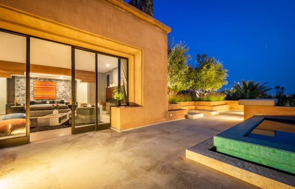 Exterior of Villa Marhba with glass doors and private pool in Marrakech